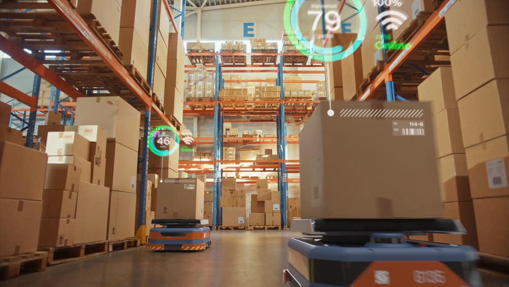 Automated transportation robots move boxes in a warehouse, one of many edge computing use cases in retail